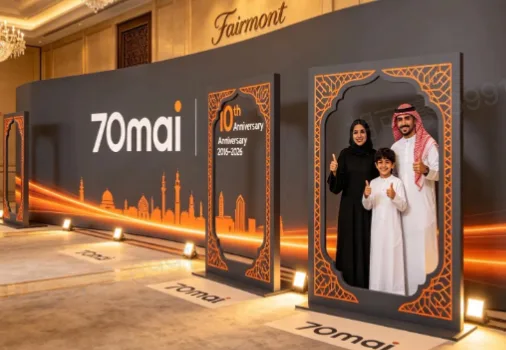 70mai 10th anniversary branded photo wall with Saudi family photo frames and anniversary display